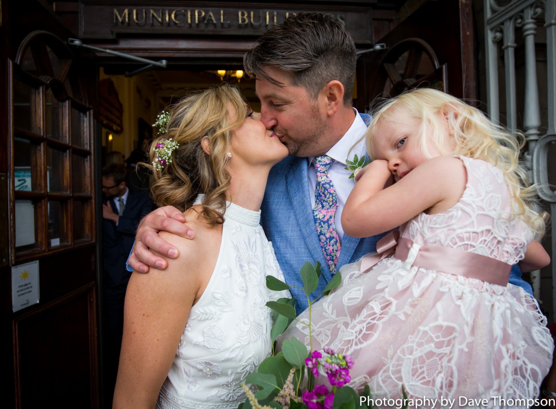 Bride and groom with their daughter