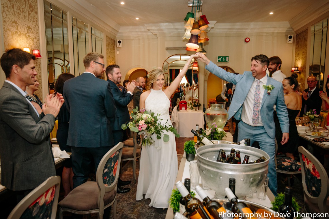 Bride and groom are greeted by guests