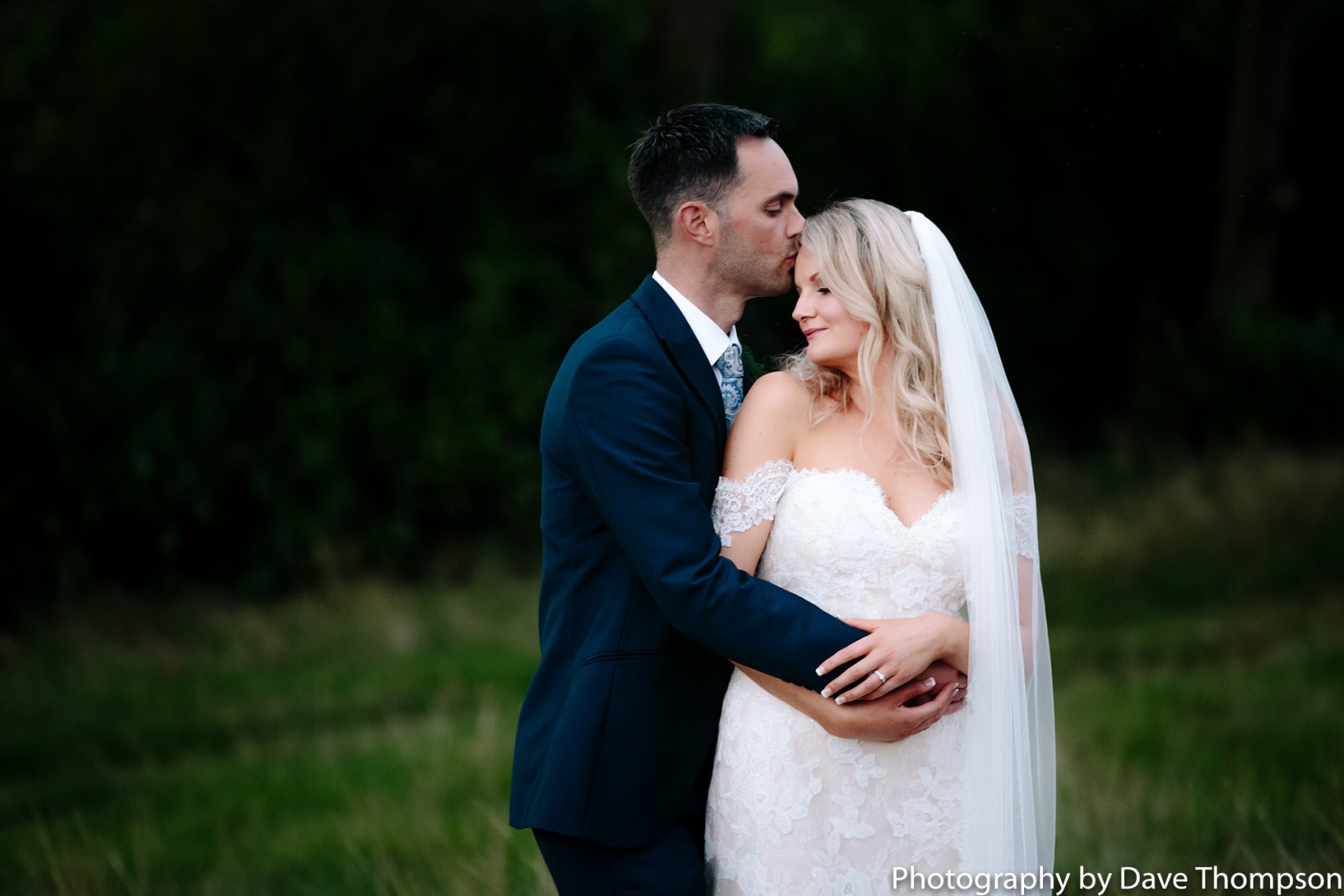 The bride and groom share a tender moment after their wedding at the Mere Resort
