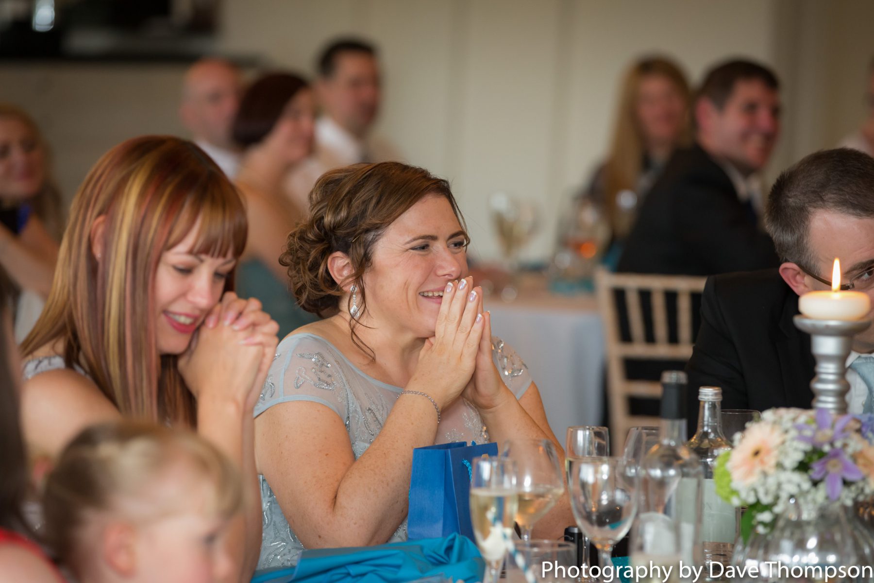A guest laughs during the speeches