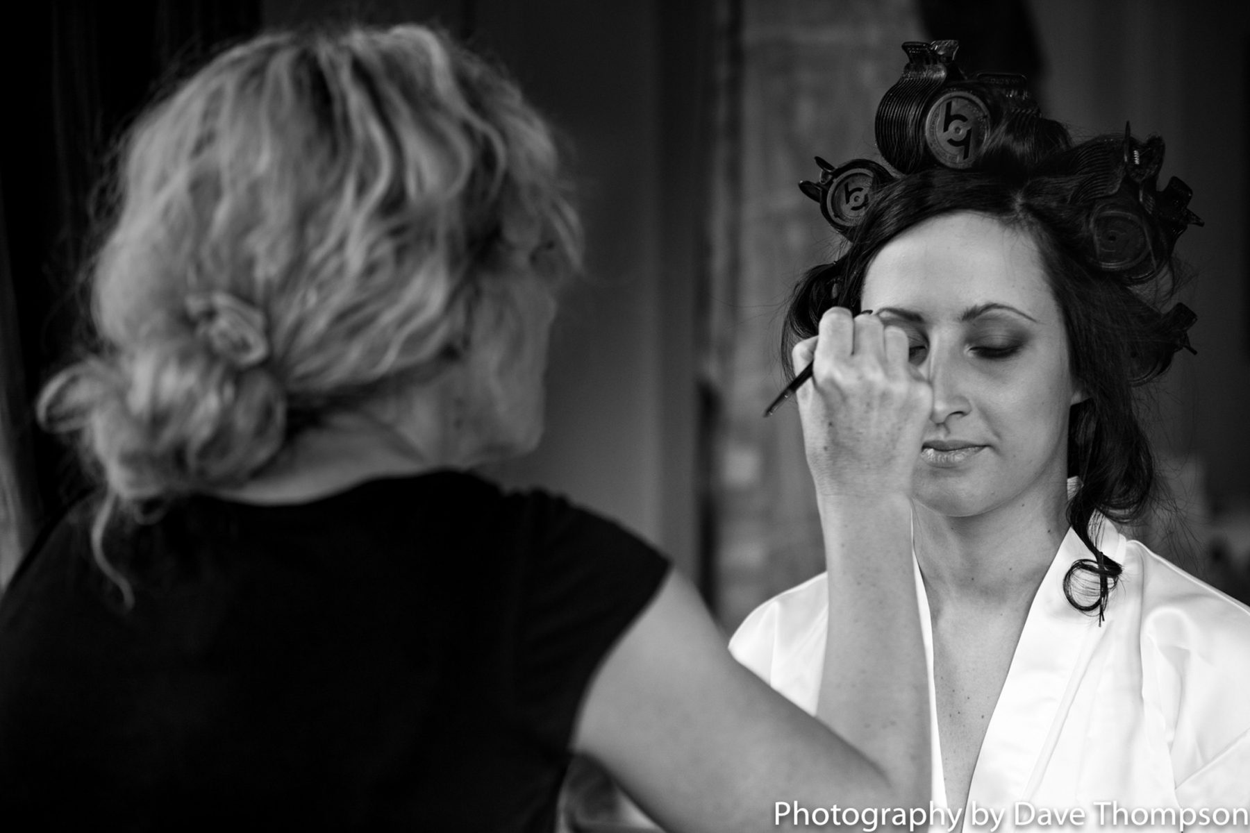Bridal prep as eye make up is applied