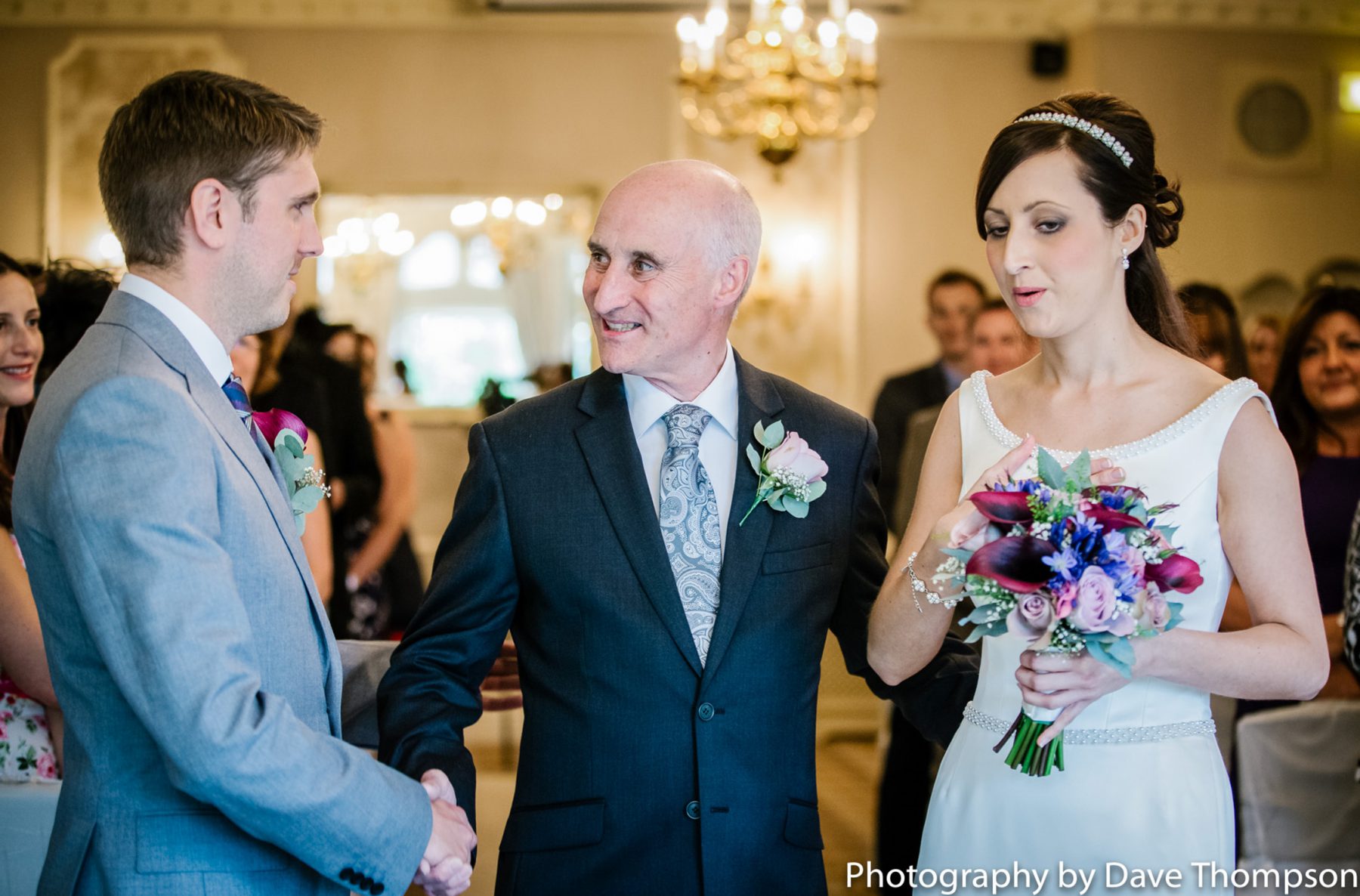 The father of the bride gives his daughter away.