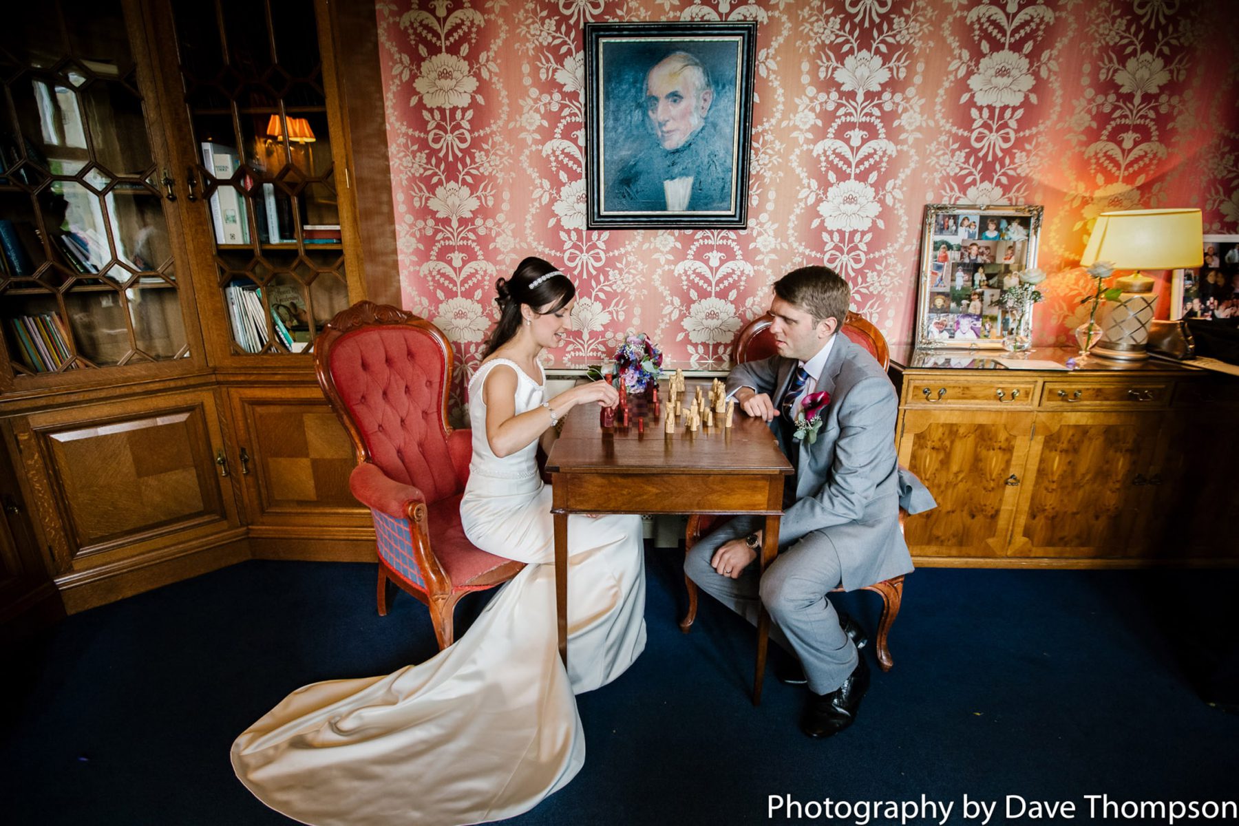 The bride and groom playing chess