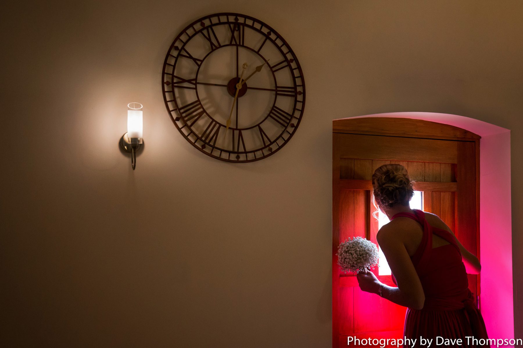 A bridesmaid looks out for the groom