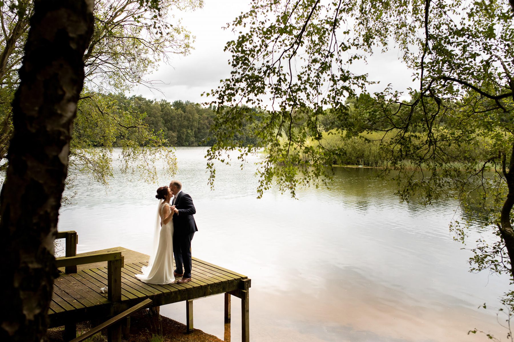 A bride and green dance by the 60acre lake at Nunsmere Hall