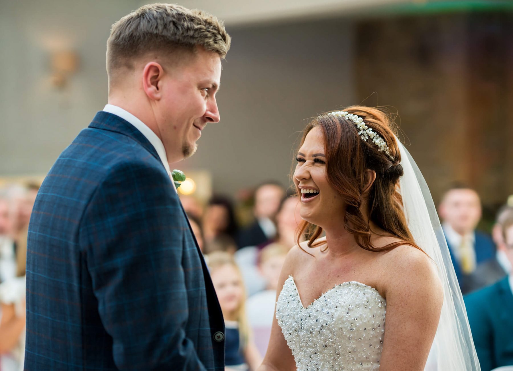 Hollin Hall Hotel Wedding Photographer - The bride and groom laugh during the ceremony