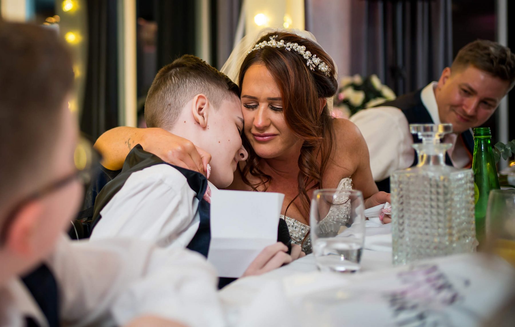 Hollin Hall Hotel Wedding Photographer - The bride hugs her son after his speech