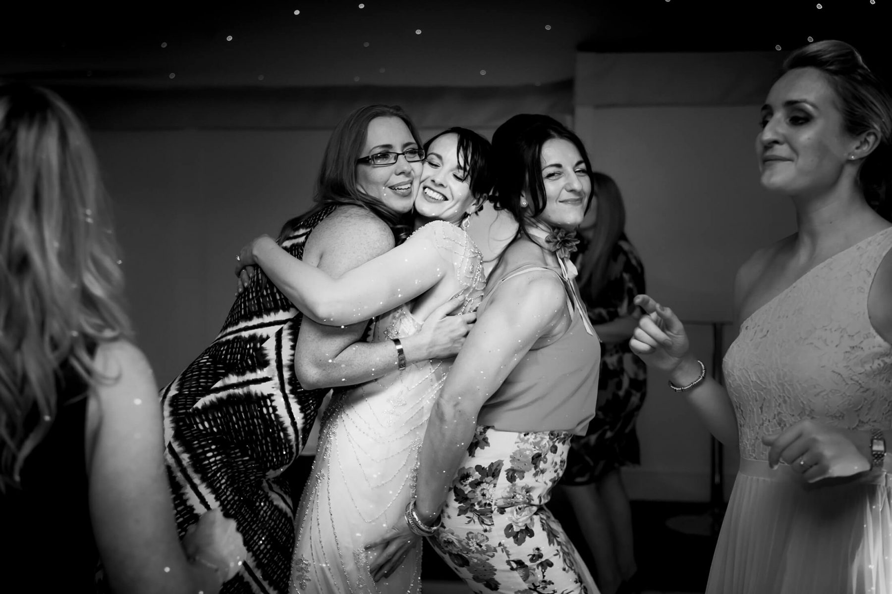 The bride dances with friends following her first dance at Combermere Abbey - Combermere Abbey Wedding Photographer
