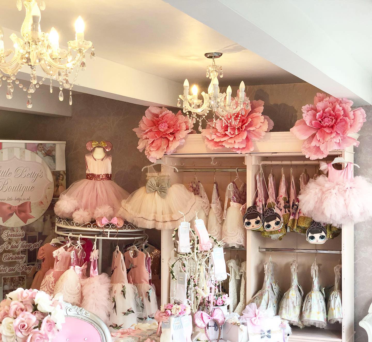 Dresses for flower girls on dirplay inside Little Betty's boutique in Stockport